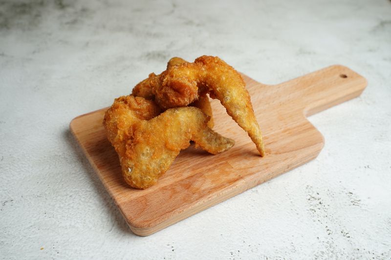 Plated chicken wings at a corporate catering event